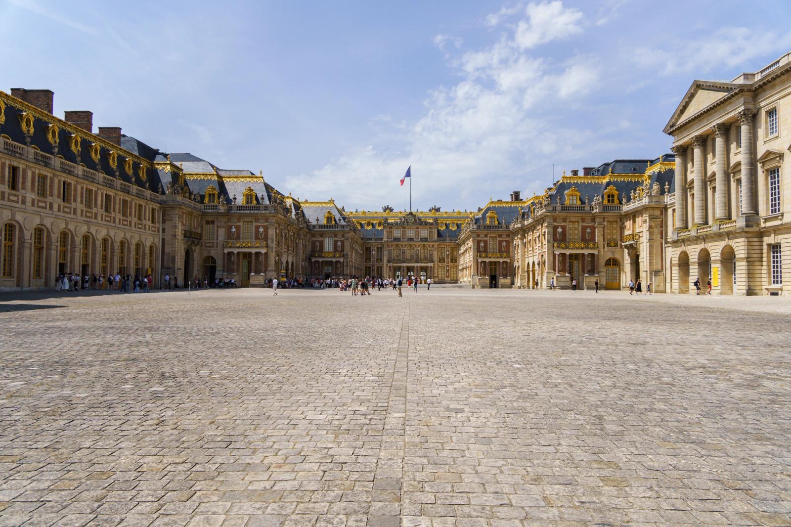 Explore the stunning architecture of the Palace of Versailles on a sunny day in Paris, France