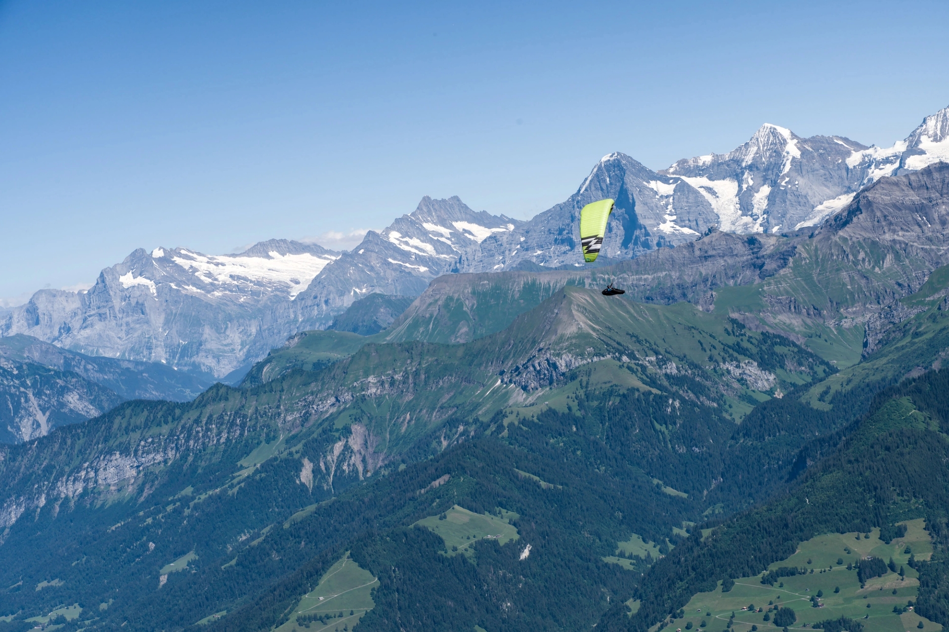 Experience thrilling paragliding over the scenic Swiss Alps with breathtaking mountain views