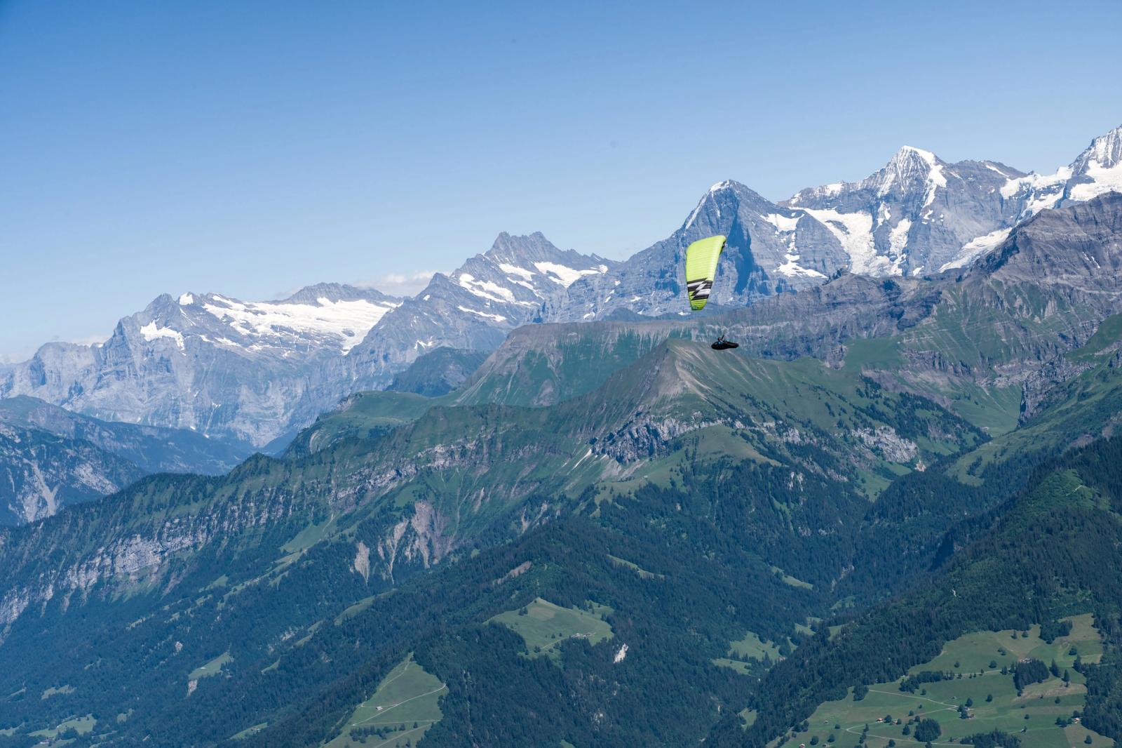 Experience thrilling paragliding over the scenic Swiss Alps with breathtaking mountain views