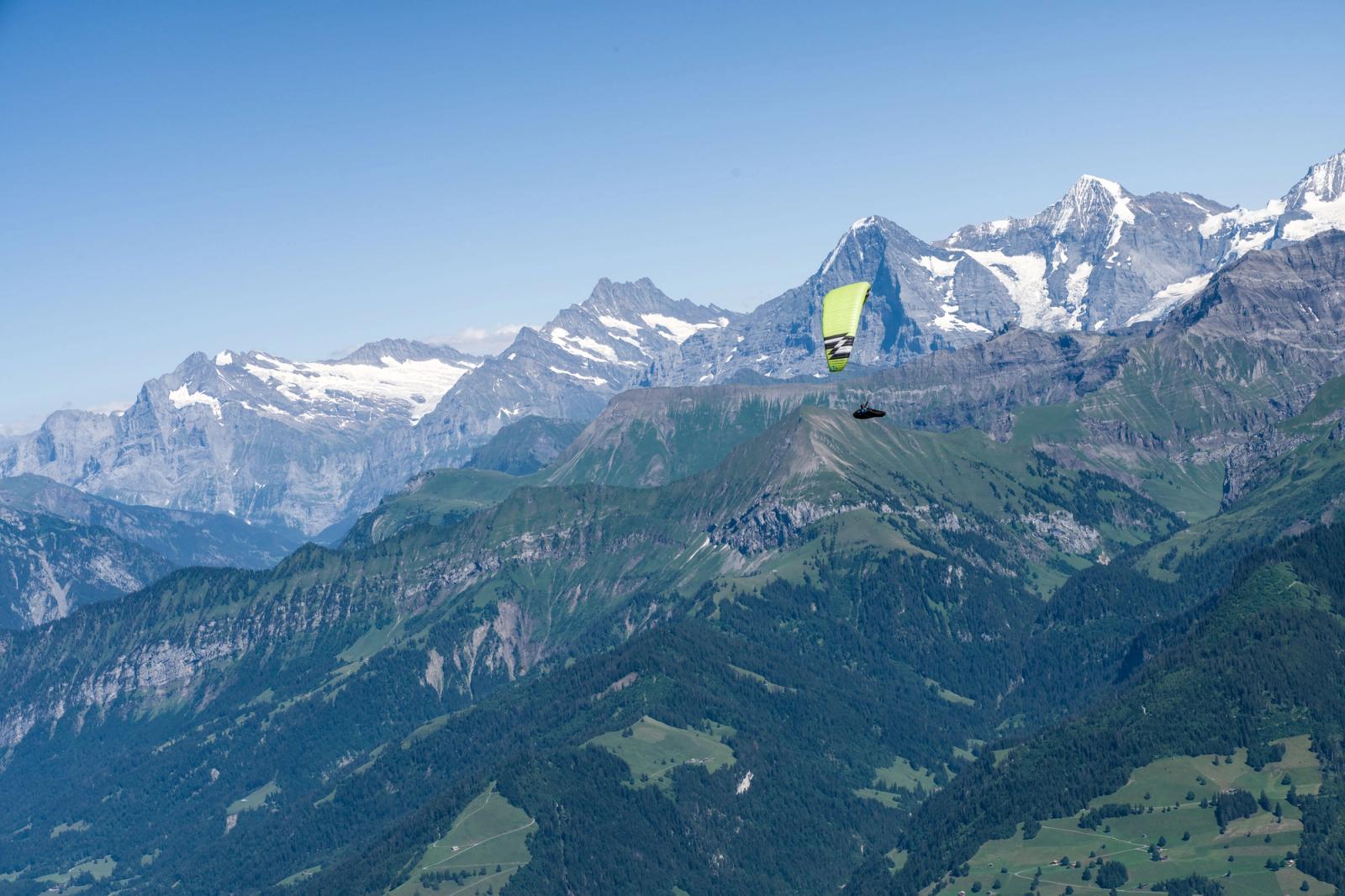 Experience thrilling paragliding over the scenic Swiss Alps with breathtaking mountain views