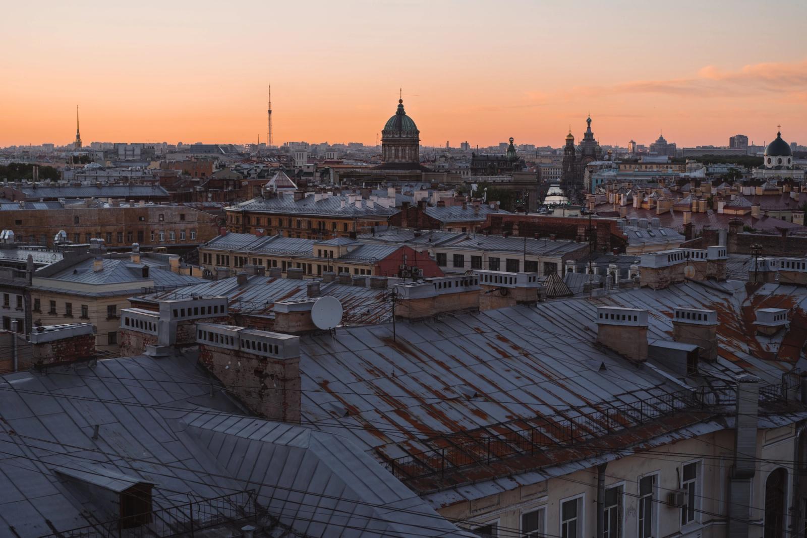 A stunning sunset over the historic rooftops of St. Petersburg, Russia