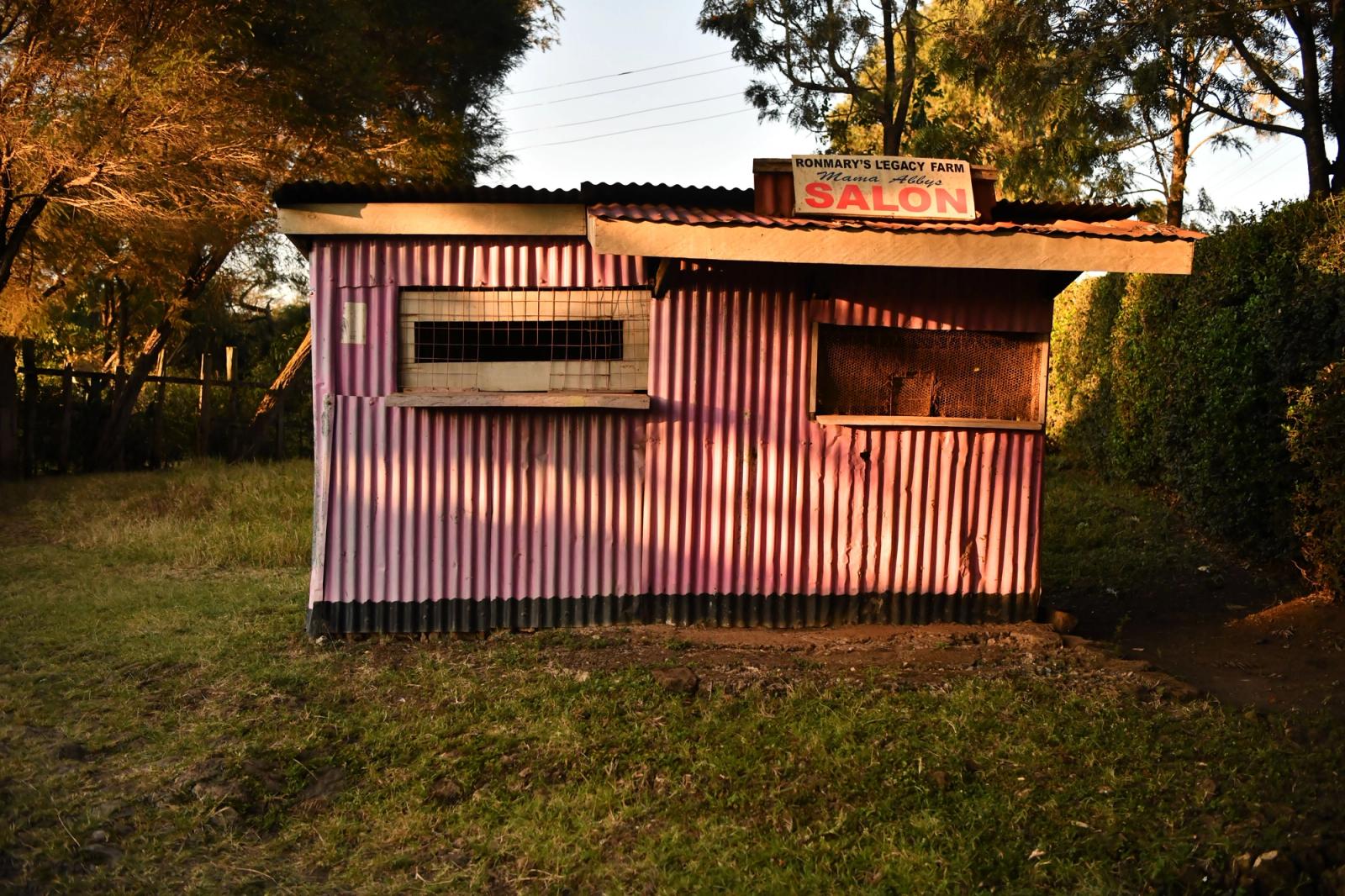 A rustic salon in Nairobi, Kenya, beautifully illuminated by the golden light of sunset