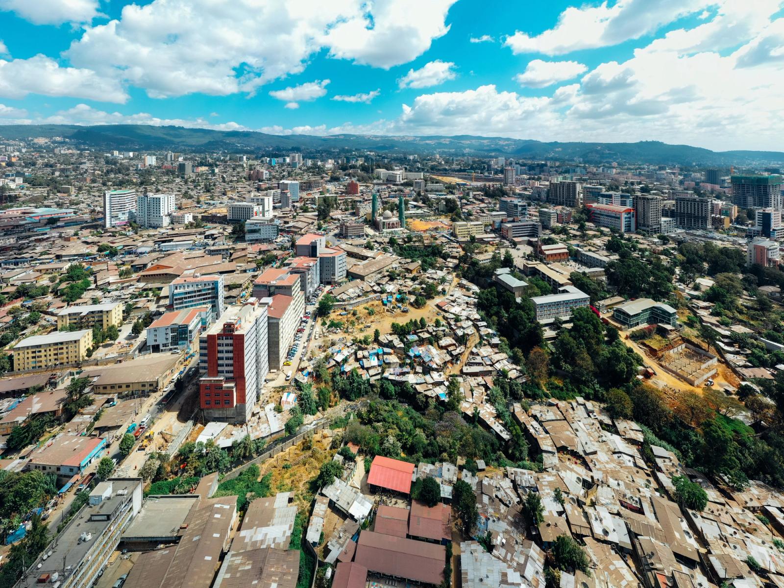 A stunning aerial shot showcasing Nairobi's skyline, balancing urban architecture with natural landscapes