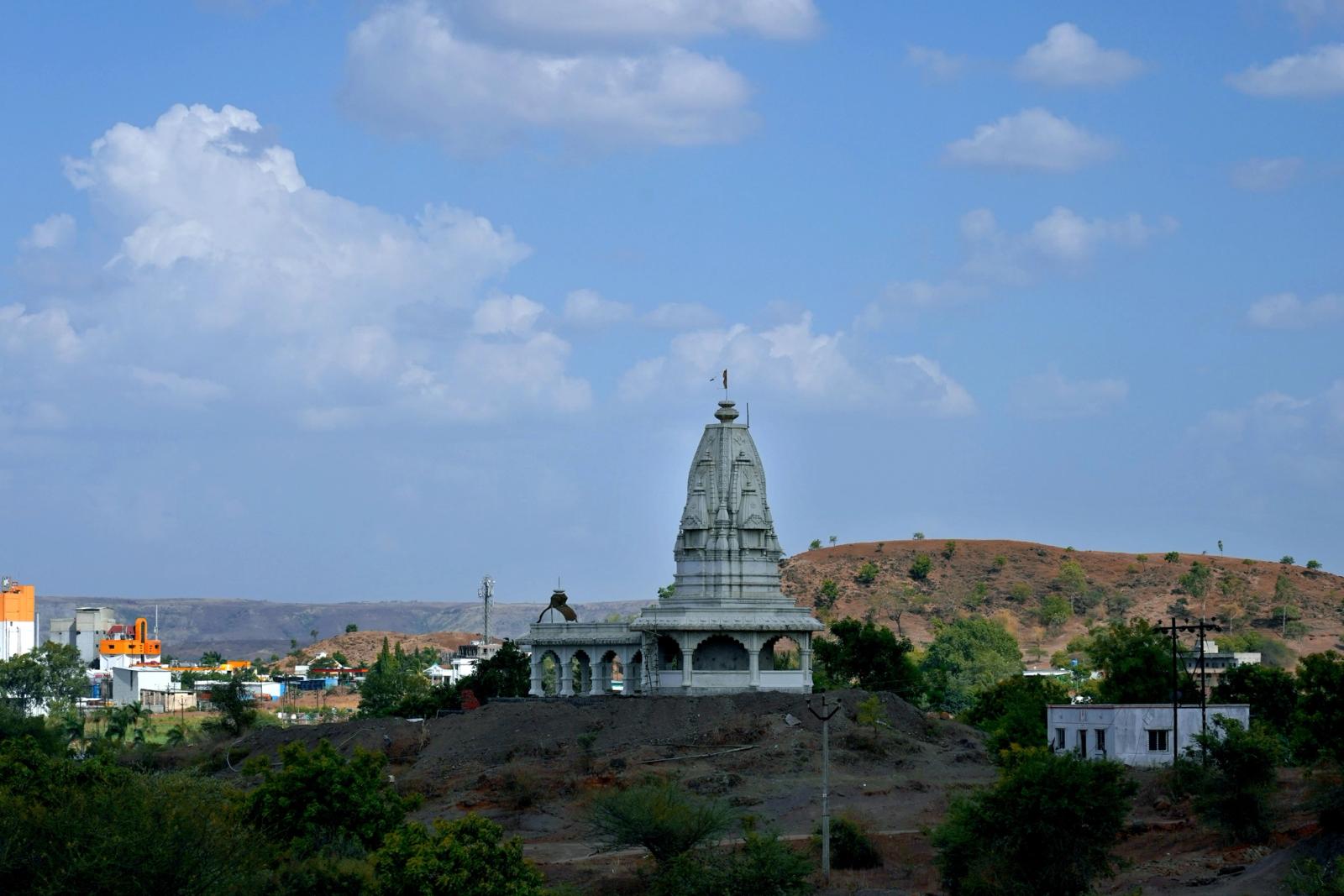 A beautiful view of Takhteshwar Temple set against the picturesque landscape of Pune, India