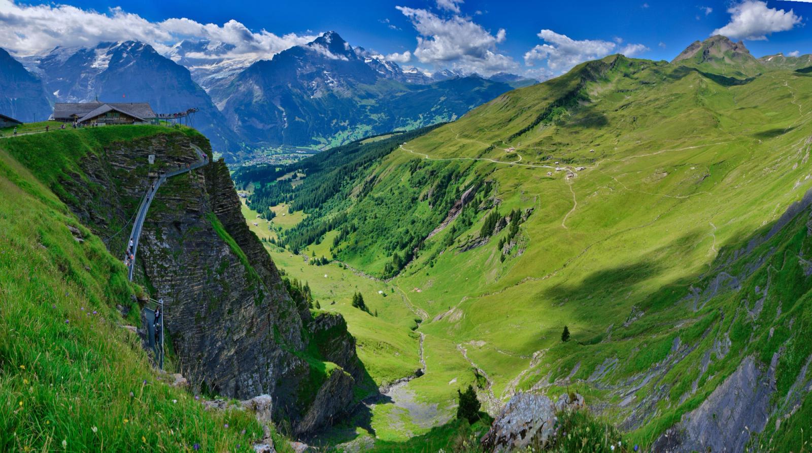 Experience the stunning scenery of Grindelwald, Switzerland, with majestic mountains and lush valleys