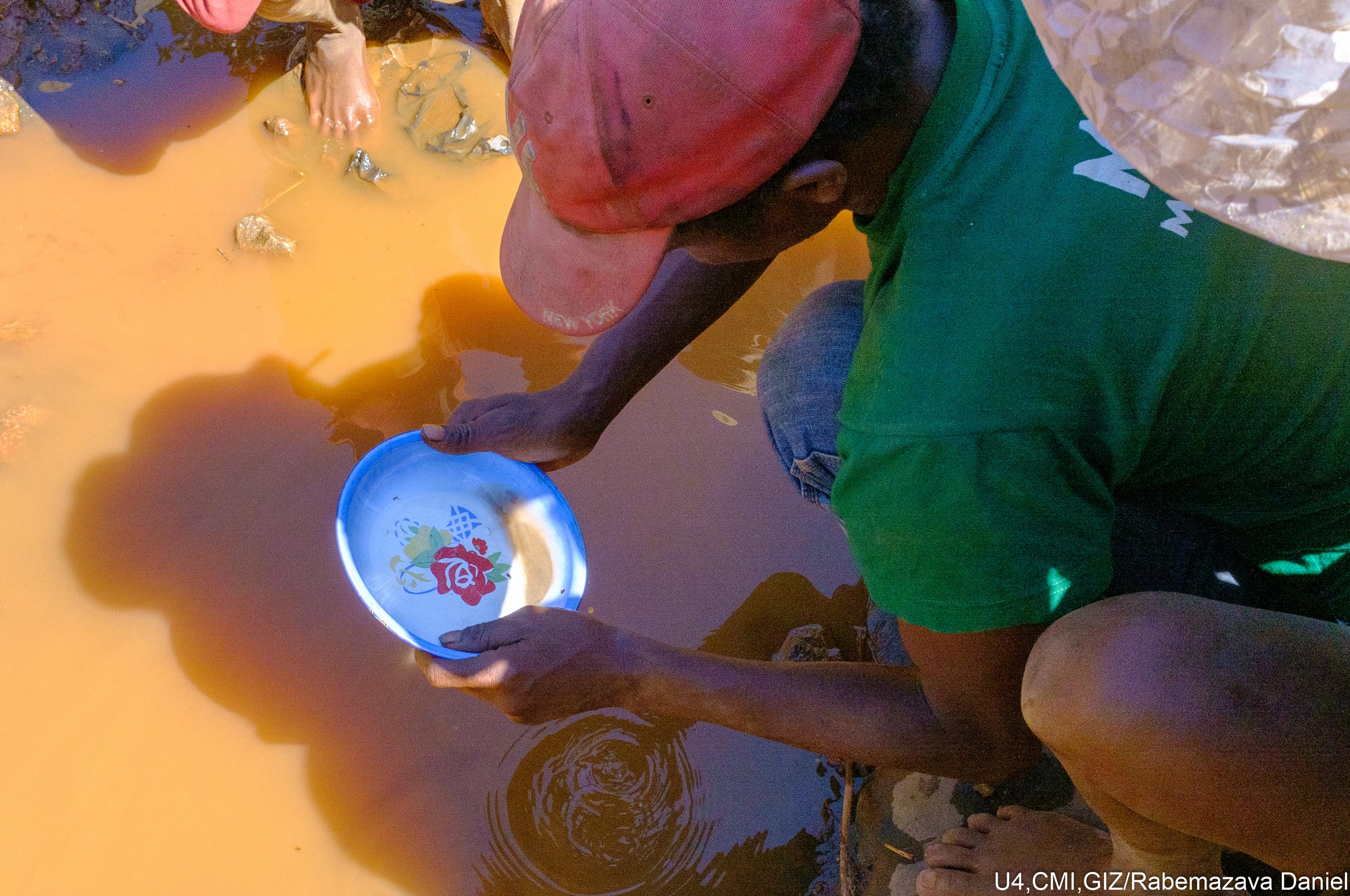 Looking for gold in a river.