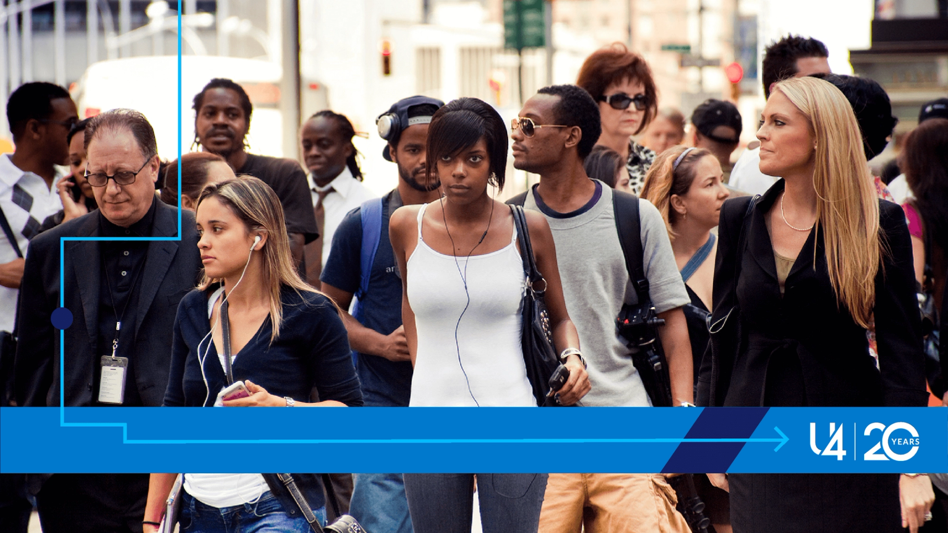 Women and men waiting for the green light before crossing the street