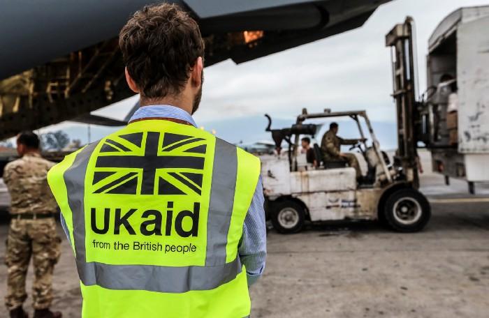 A DFID staff member supervises the unloading of UK aid from an RAF C-17 aircraft in Kathmundu, Nepal on the 29 April 2015.