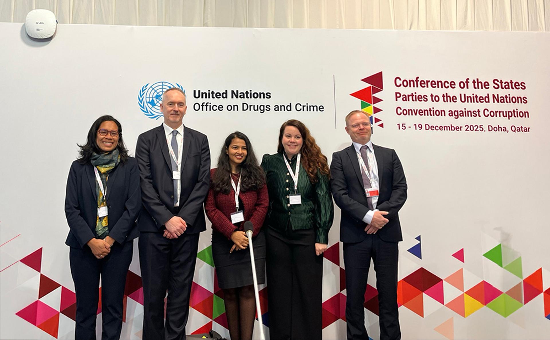 Five people standing together at CoSP event