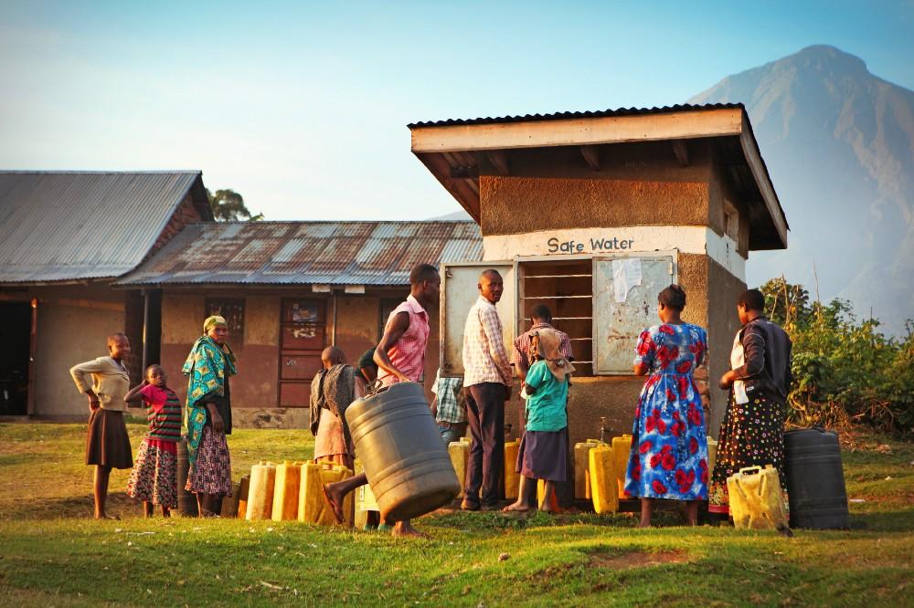 Local villagers waiting with plastic canisters to get safe water from public water well