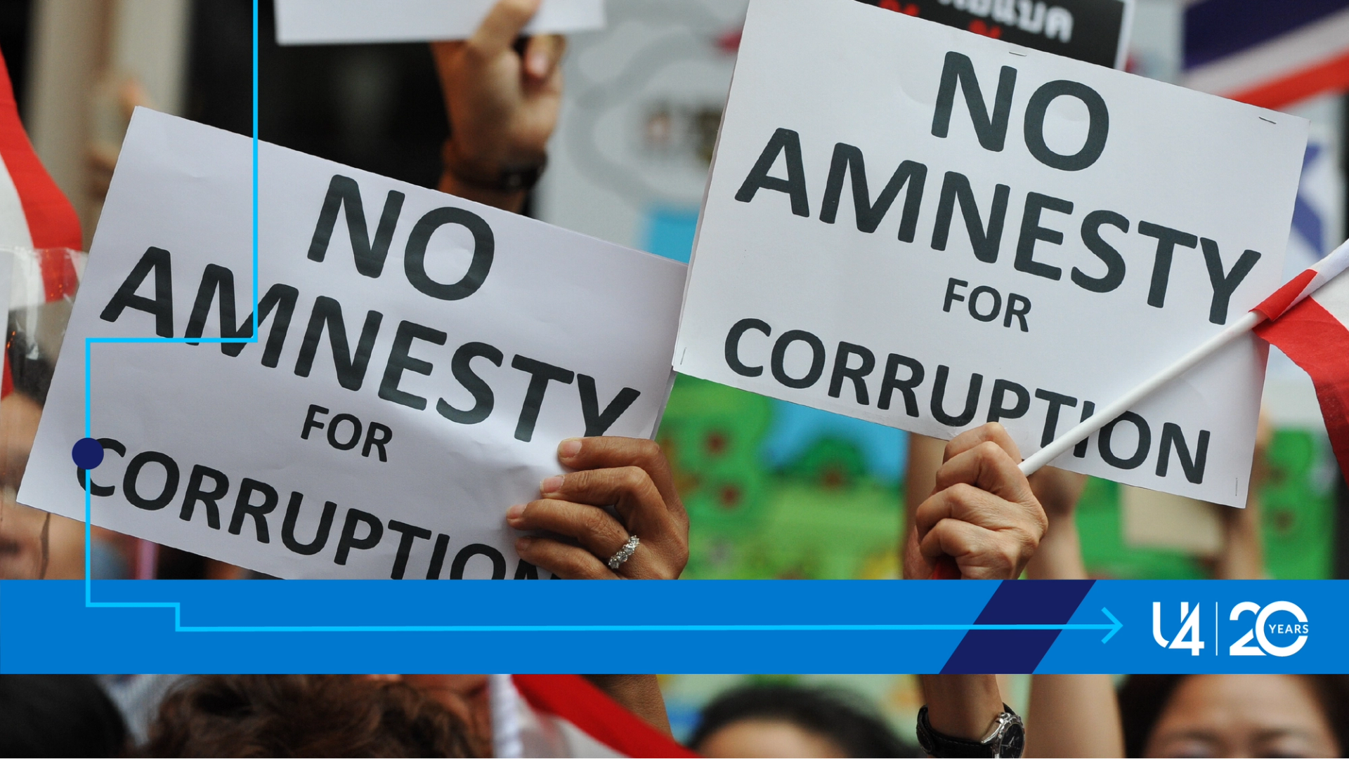 Protesters holding posters saying 'no amnesty for corruption'