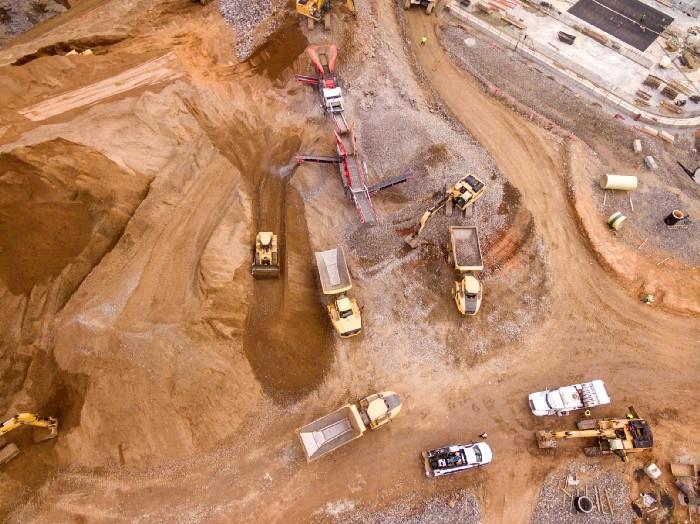 Aerial view of a mine with machinery and vehicles