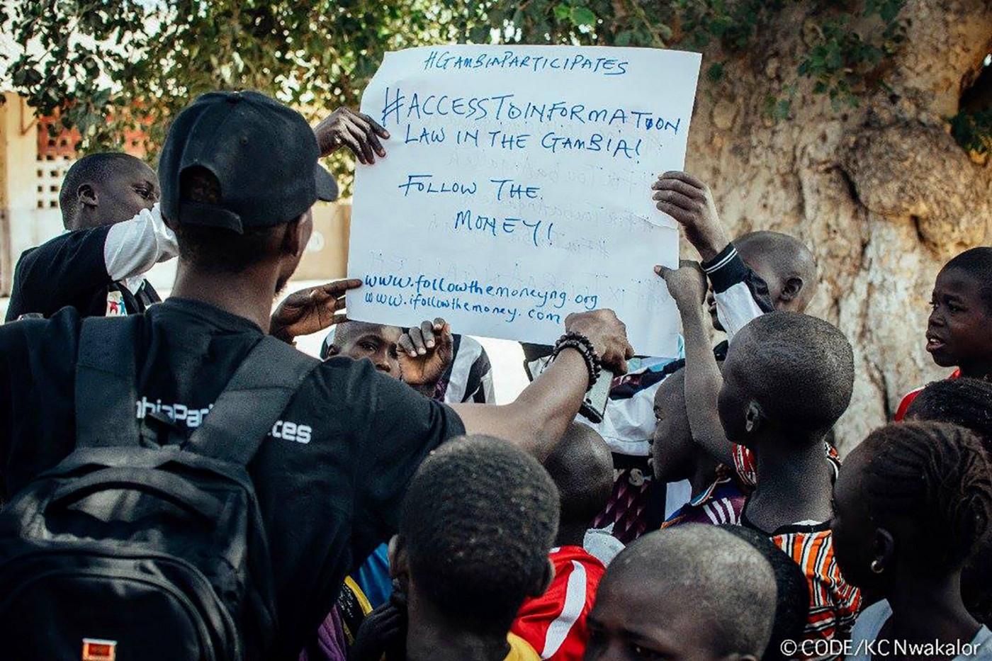 People holding a poster