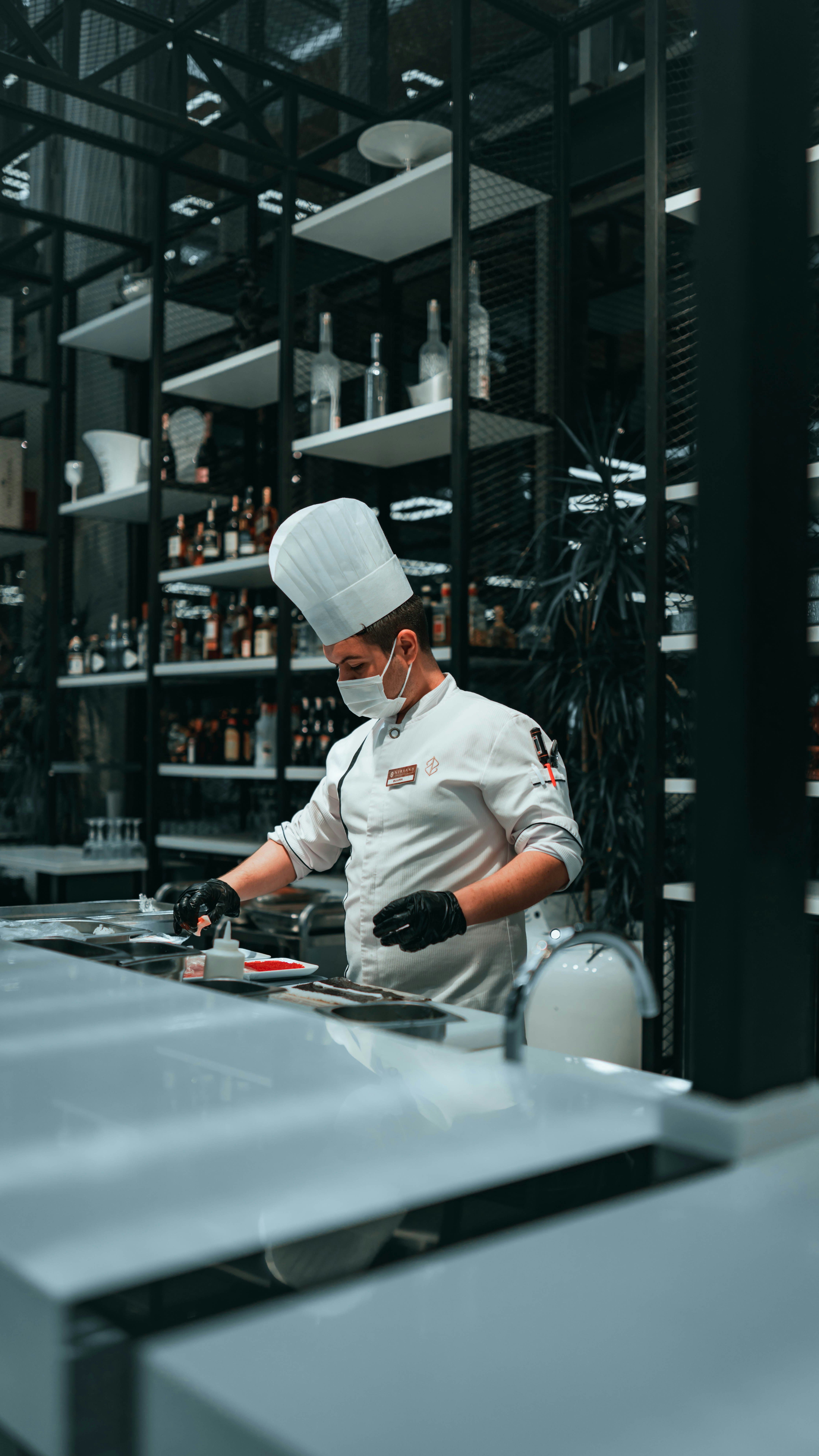 Chef in a professional kitchen in a restaurant preparing food