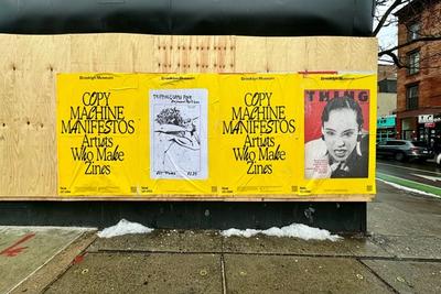 Four yellow posters for Brooklyn Museum's "Copy Machine Manifestos" exhibition on plywood.