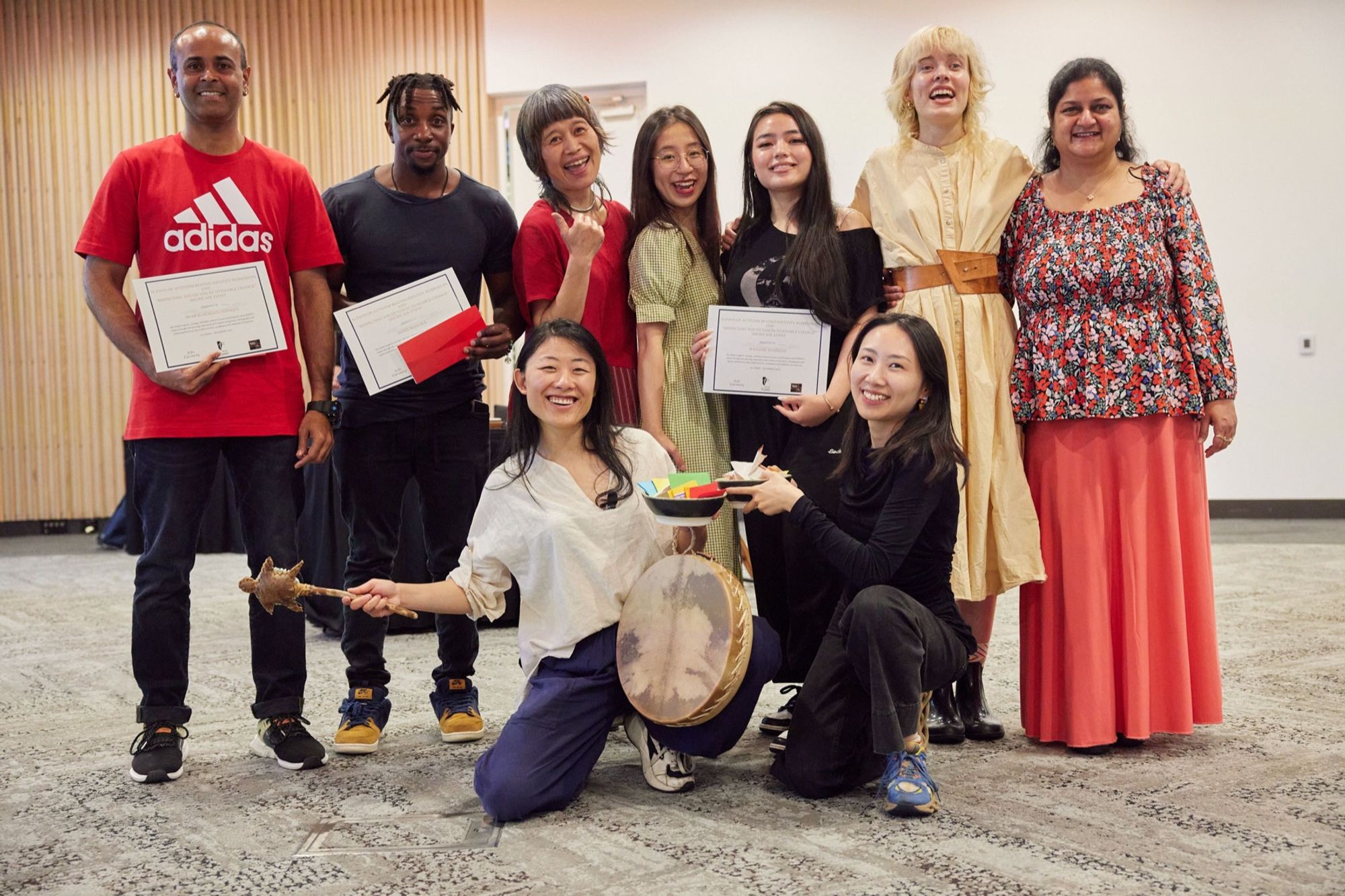 Beyond Identity artists and team holding certificates