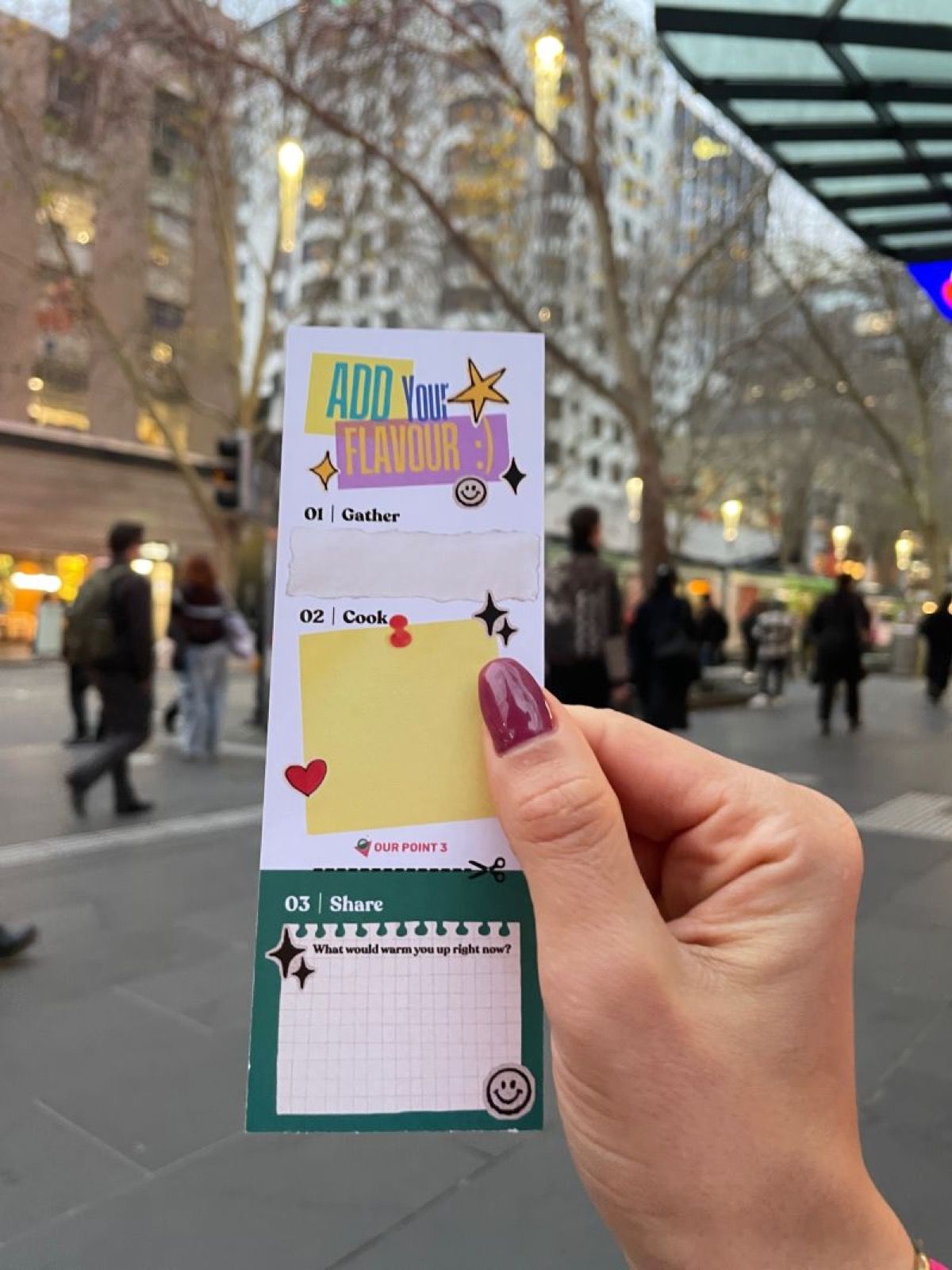 A hand holding a hot pot connection ticket in the city