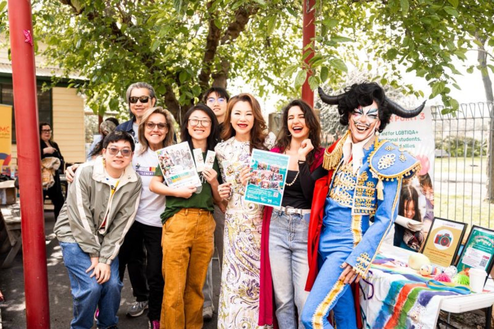 Festival-goers smiling with programs in hand