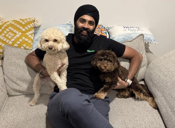 Karam and his two Cavoodles.
