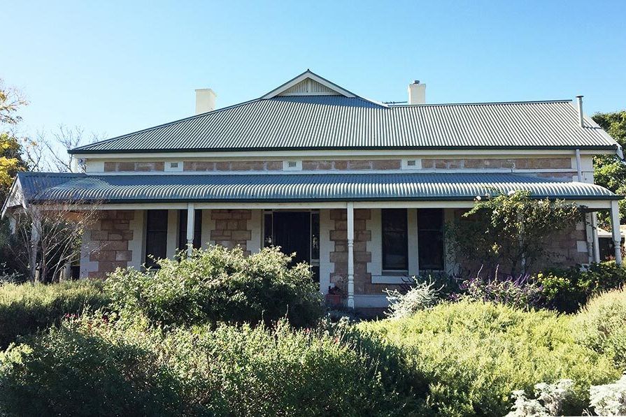 A classic heritage Australian villa with luscious front garden.