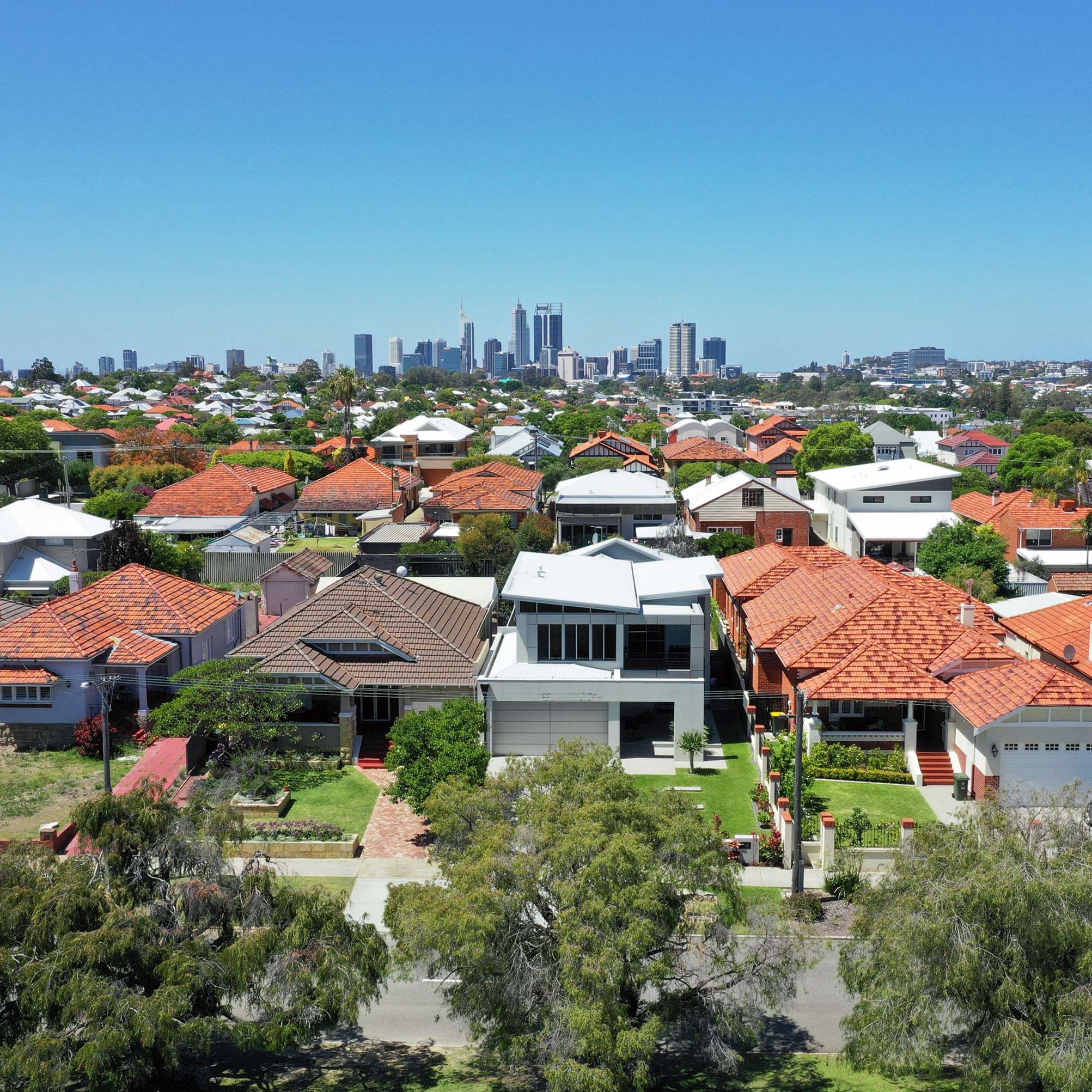 A high view of a suburb in Perth with the CBD in the background