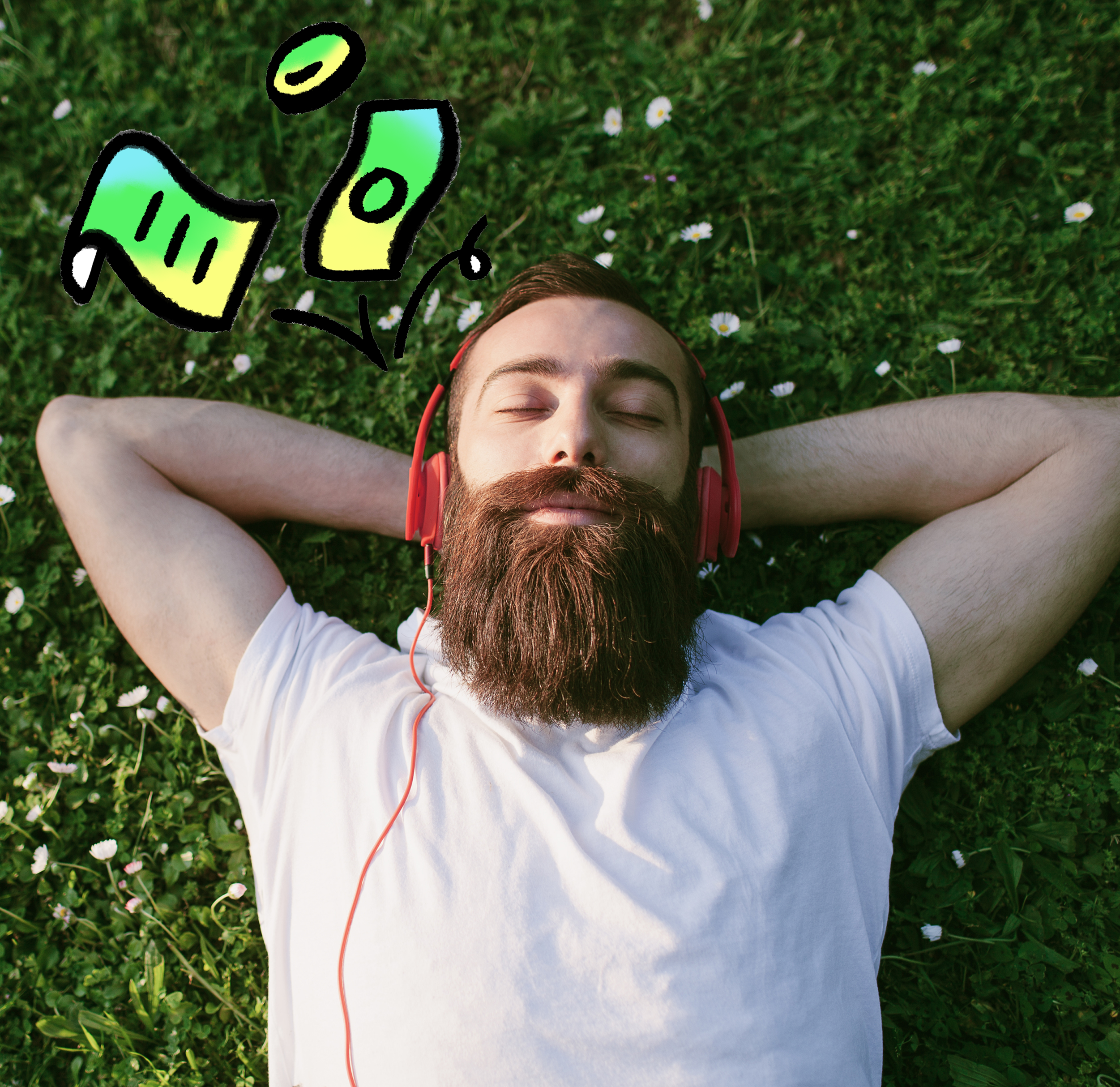 Man with beard relaxing on the grass listening to headphones