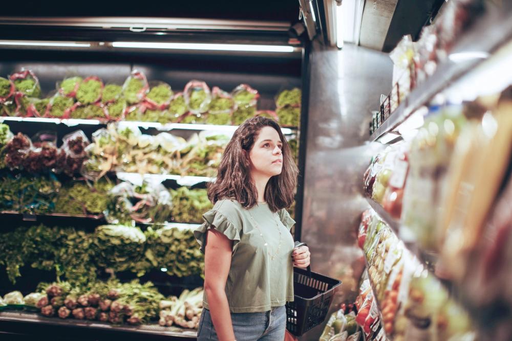 Shelf with coloured prints and handing storage below