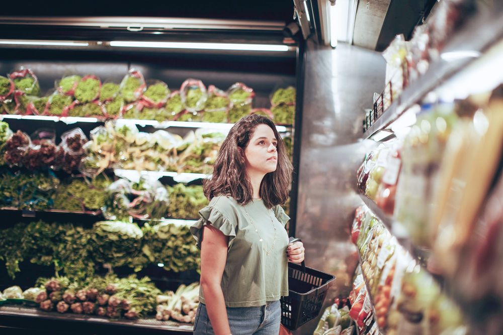 Shelf with coloured prints and handing storage below
