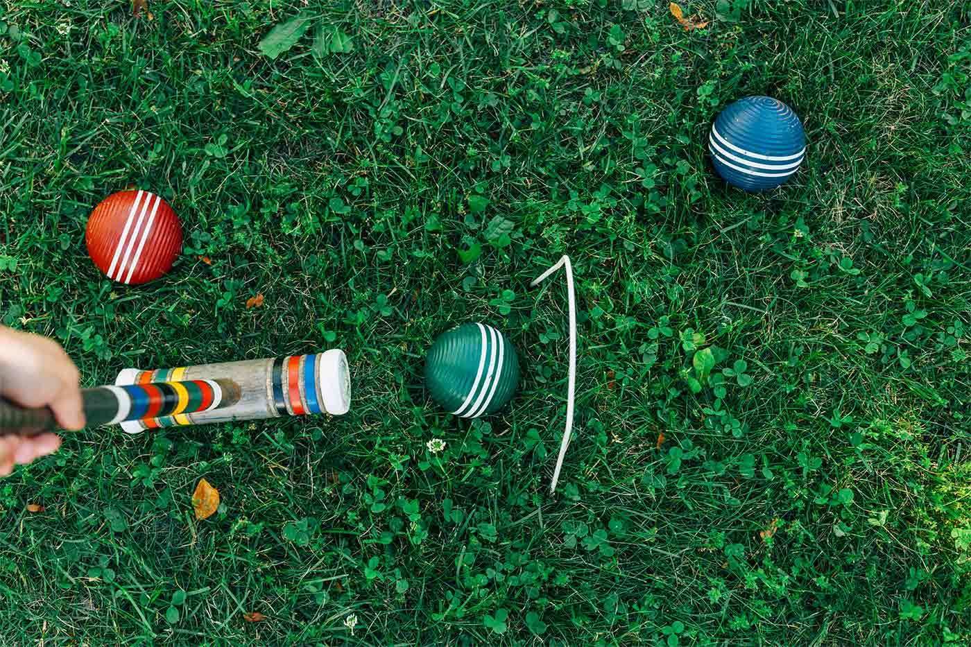 croquet, red, green and blue ball on grass