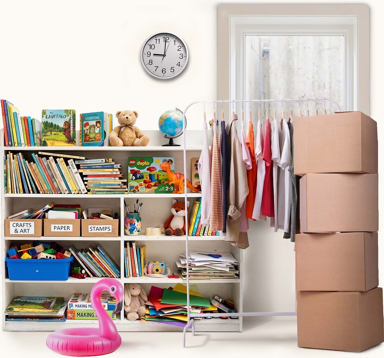 A busy house with boxes, clothes and bookshelfs.