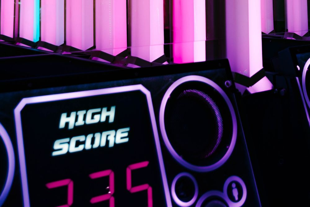 Neon lighting with a console reading high score and the number 235.