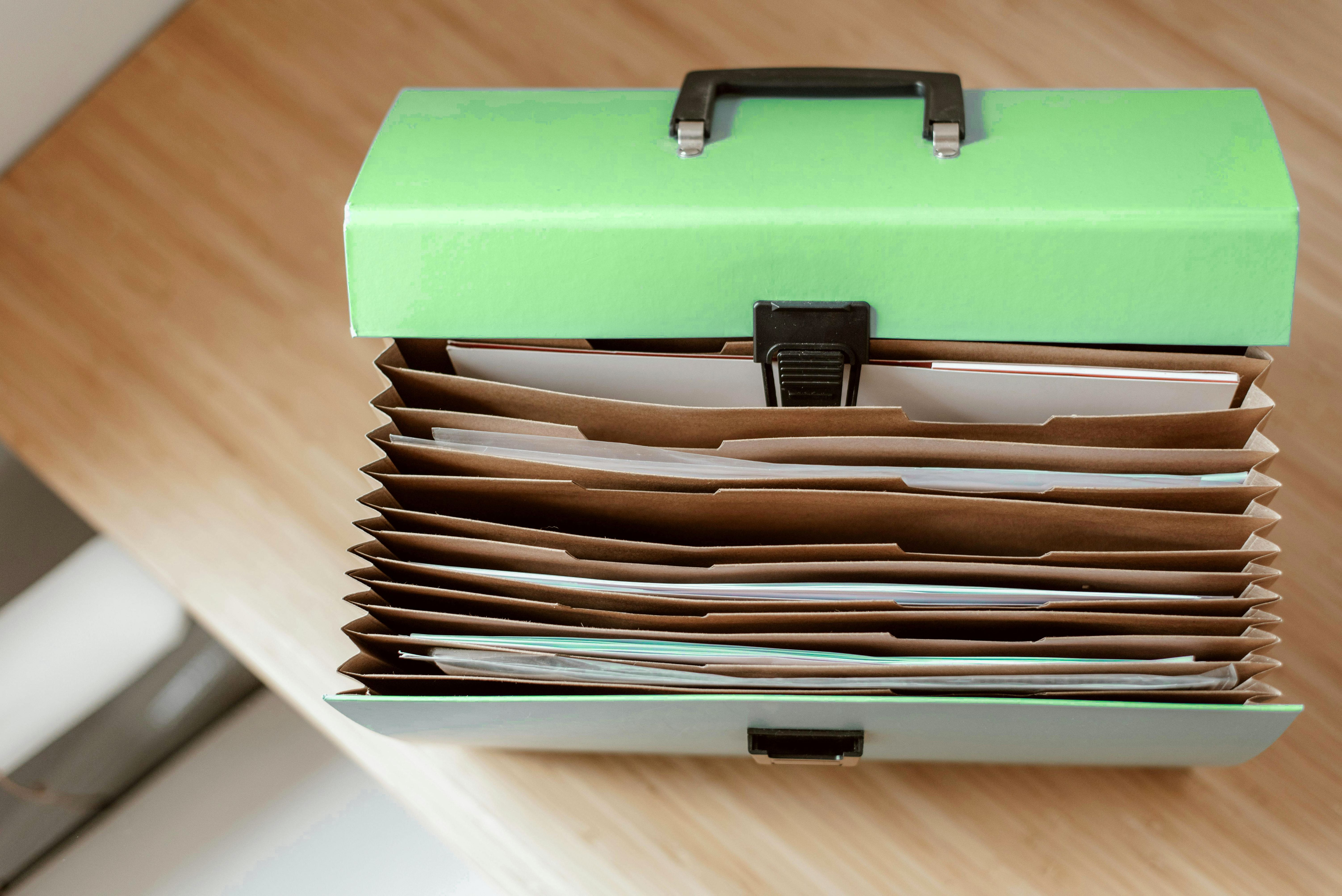 Portable files storage case. Open with many sections visible.