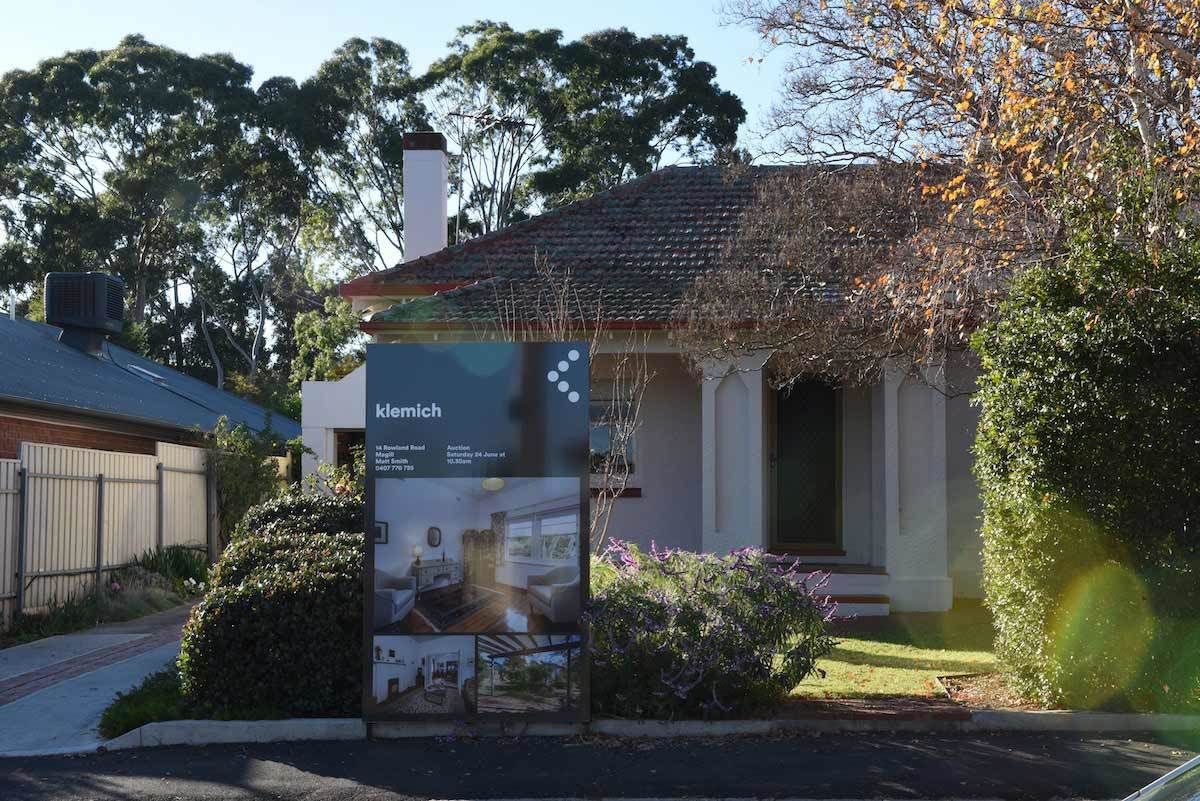 house for sale with klemich real estate sign out the front