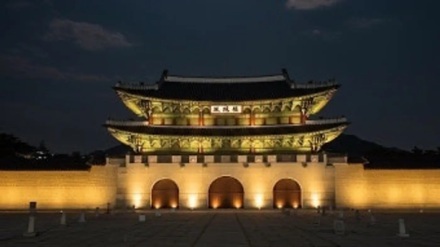 Gwanghwamun Gate at Gyeongbokgung Palace illuminated against the night sky in Jongno, Seoul
