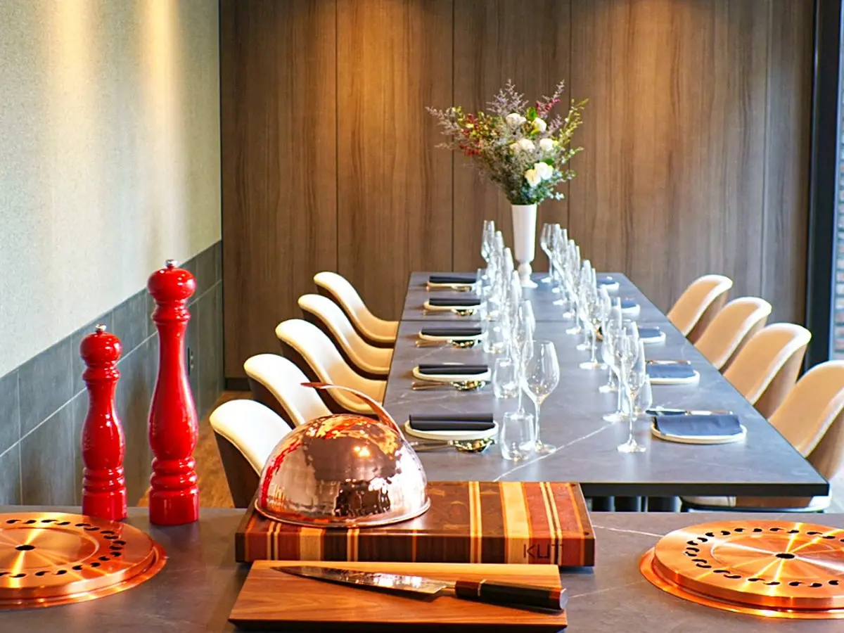 A private room at KUT SEOUL set for a celebration dinner, table laid beside the window
