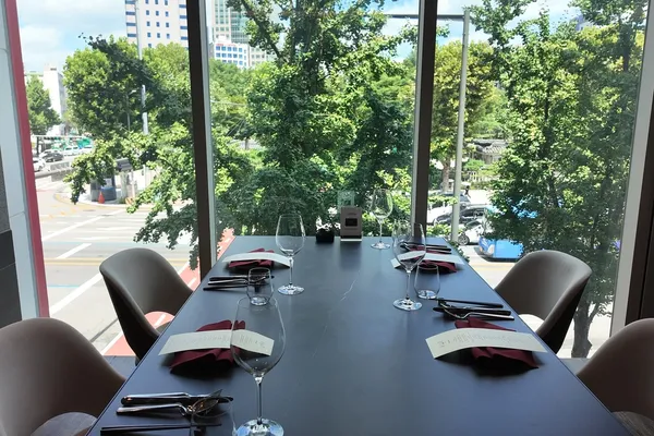 View from KUT SEOUL on the third floor of Hanol Tower, overlooking Jongno and the trees of Tapgol Park in central Seoul