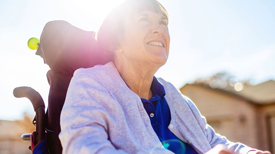 Woman in a wheelchair in the sun