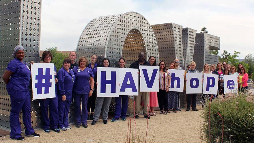 Nurses at LOVE sign holding HAVHOPE signs
