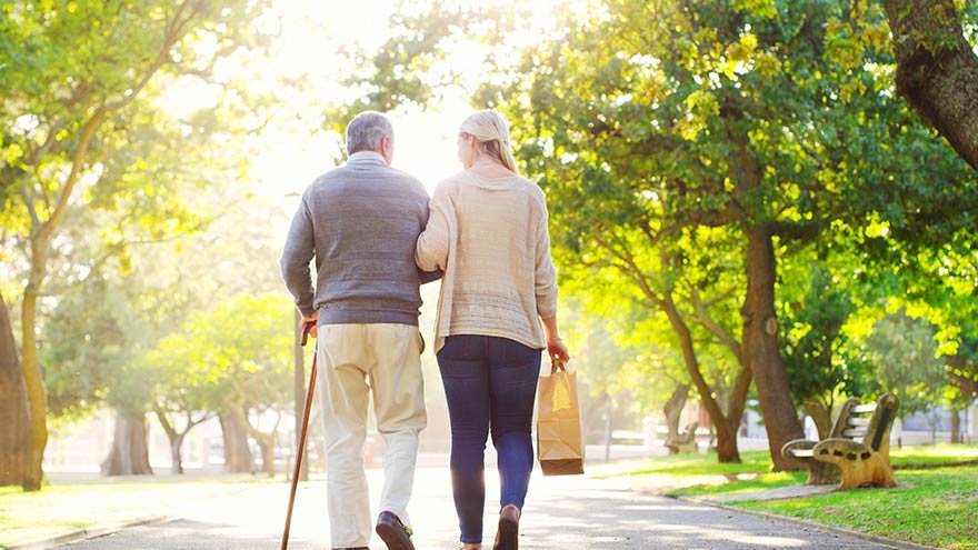 Man walking with a women holding a bag