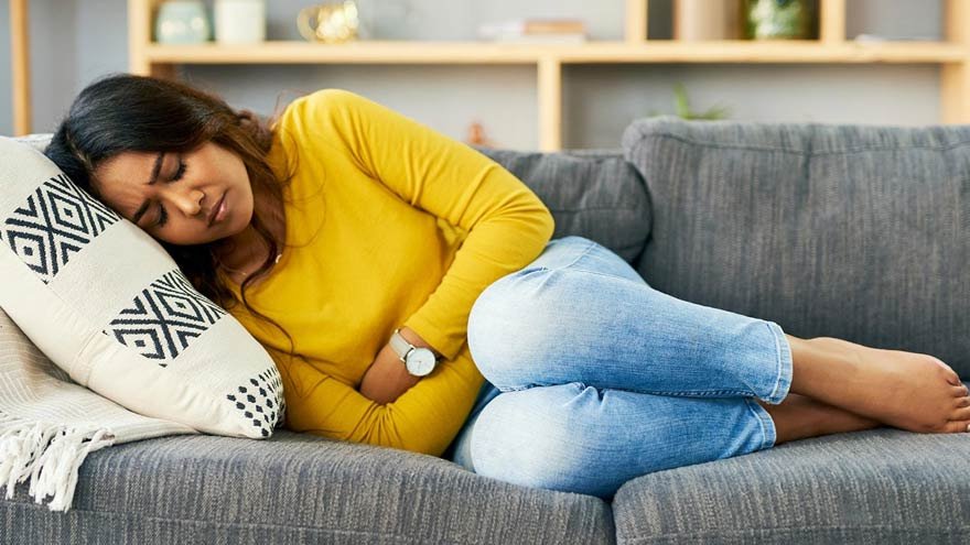 A lady laying on a couch