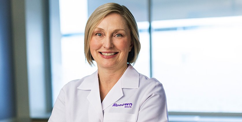 Dr. Condon posing for photo in patient room