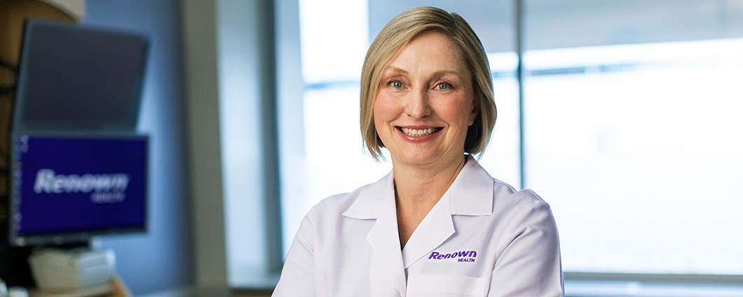Dr. Condon posing for photo in patient room