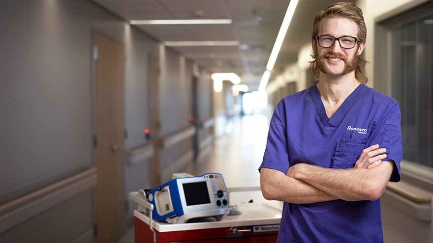 Nurse standing next to equipment