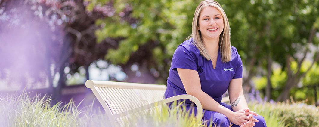 Renown nurse sitting in Fianna's Healing Garden located at Renown Regional