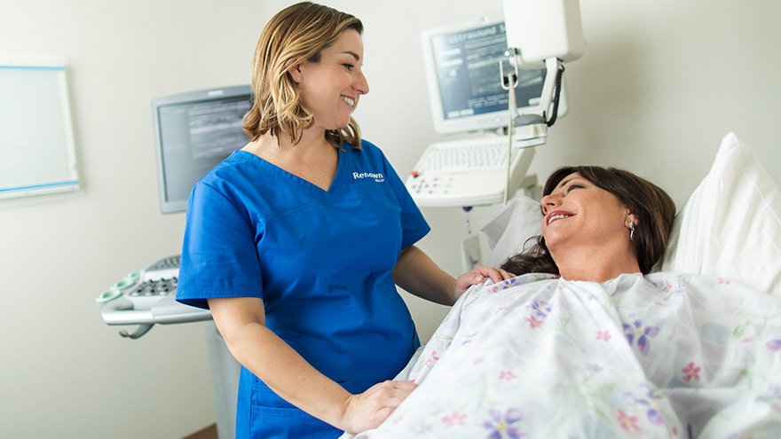 Renown provider assisting patient with mammogram