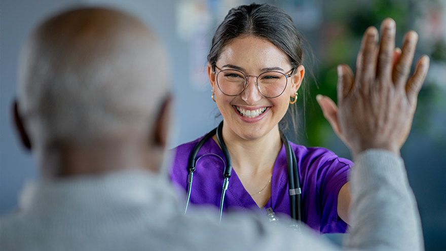 A provider high-fives her patient
