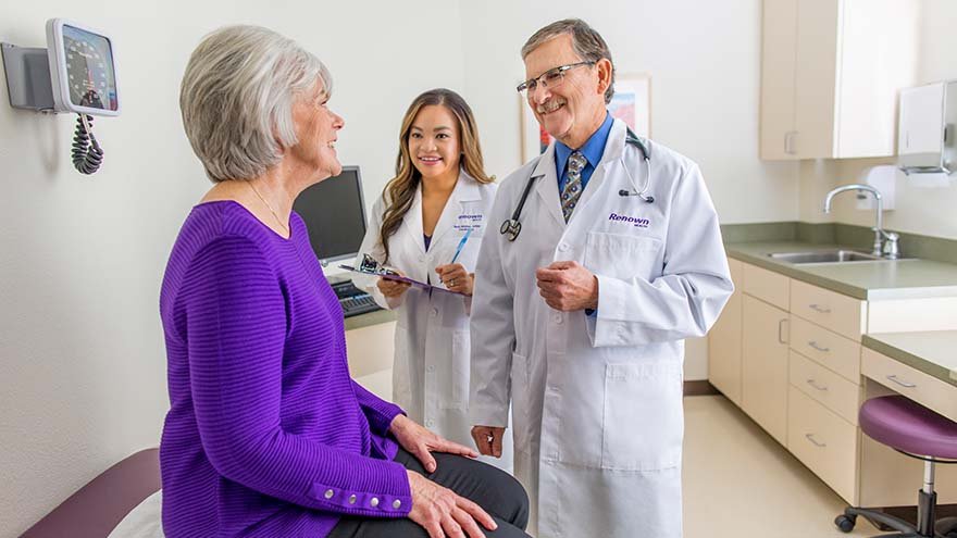 Renown providers talking to elderly patient