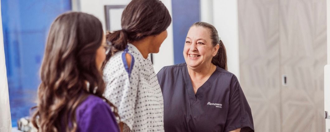 Nurse taking a woman's blood presure