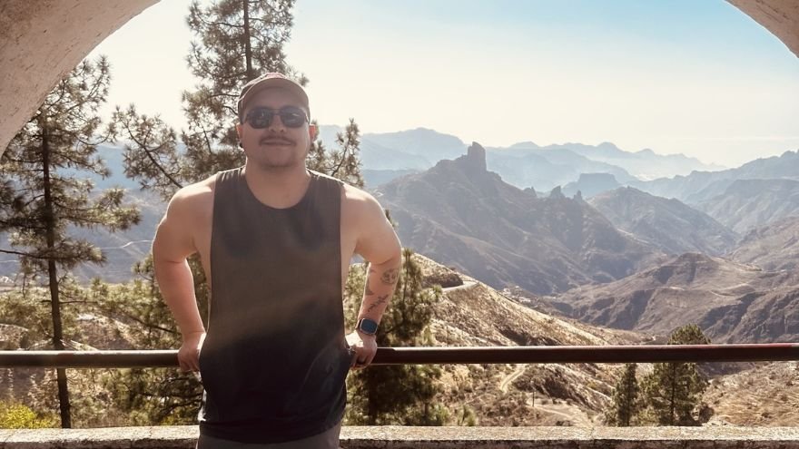Alejandro posing in front of scenic overlook