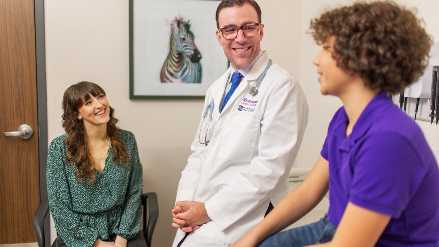 Mother and son in Renown pediatric office speaking with doctor